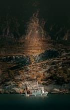 A fishing boat casting nets near the rugged coastline of Prince of Wales Island.