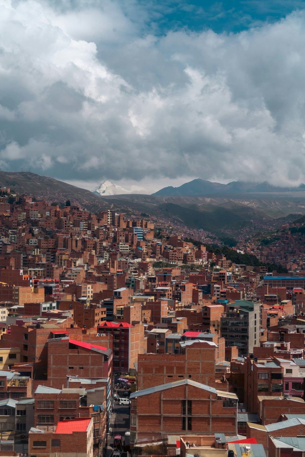 a view of a city with mountains in the background