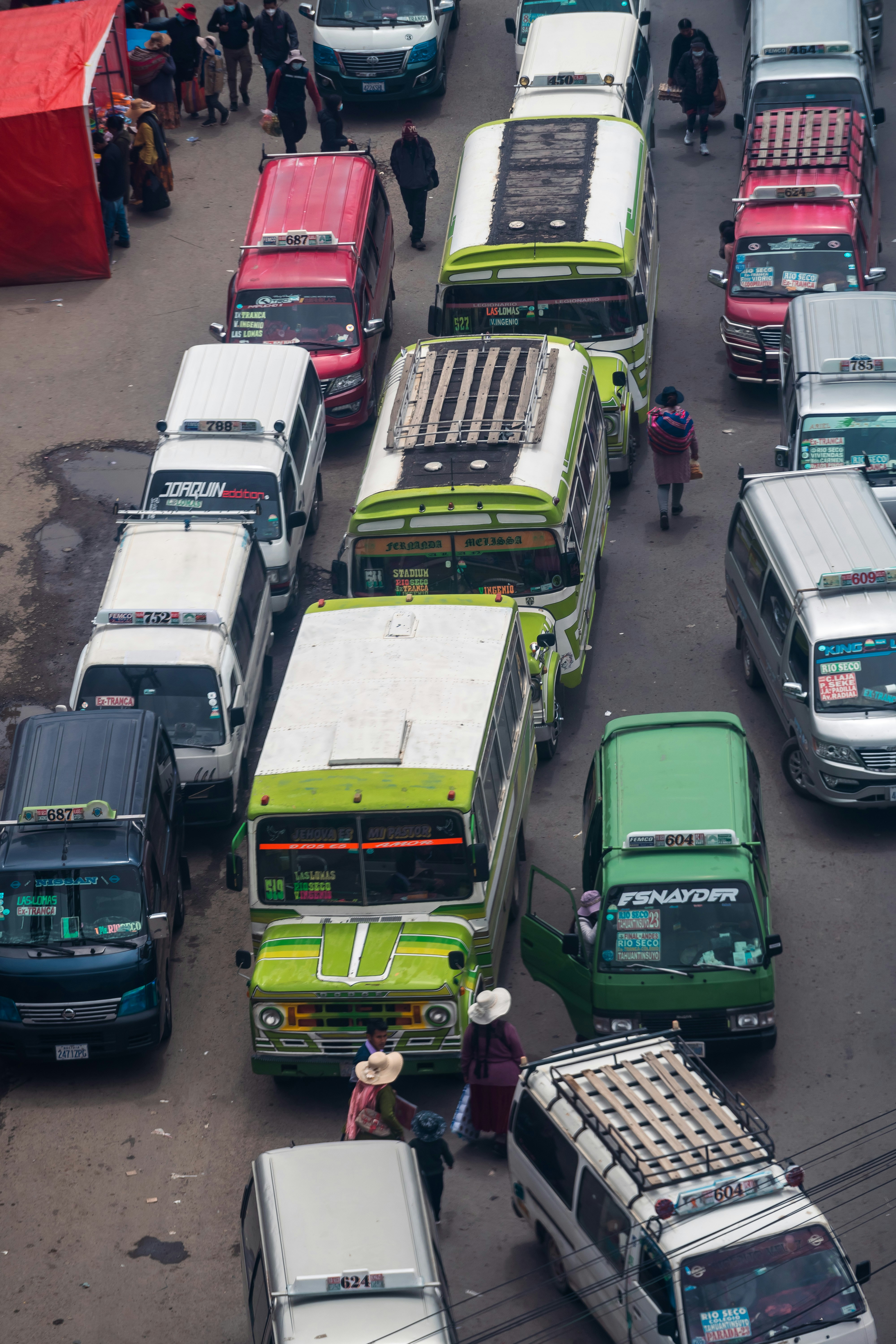 a bunch of buses that are sitting in the street