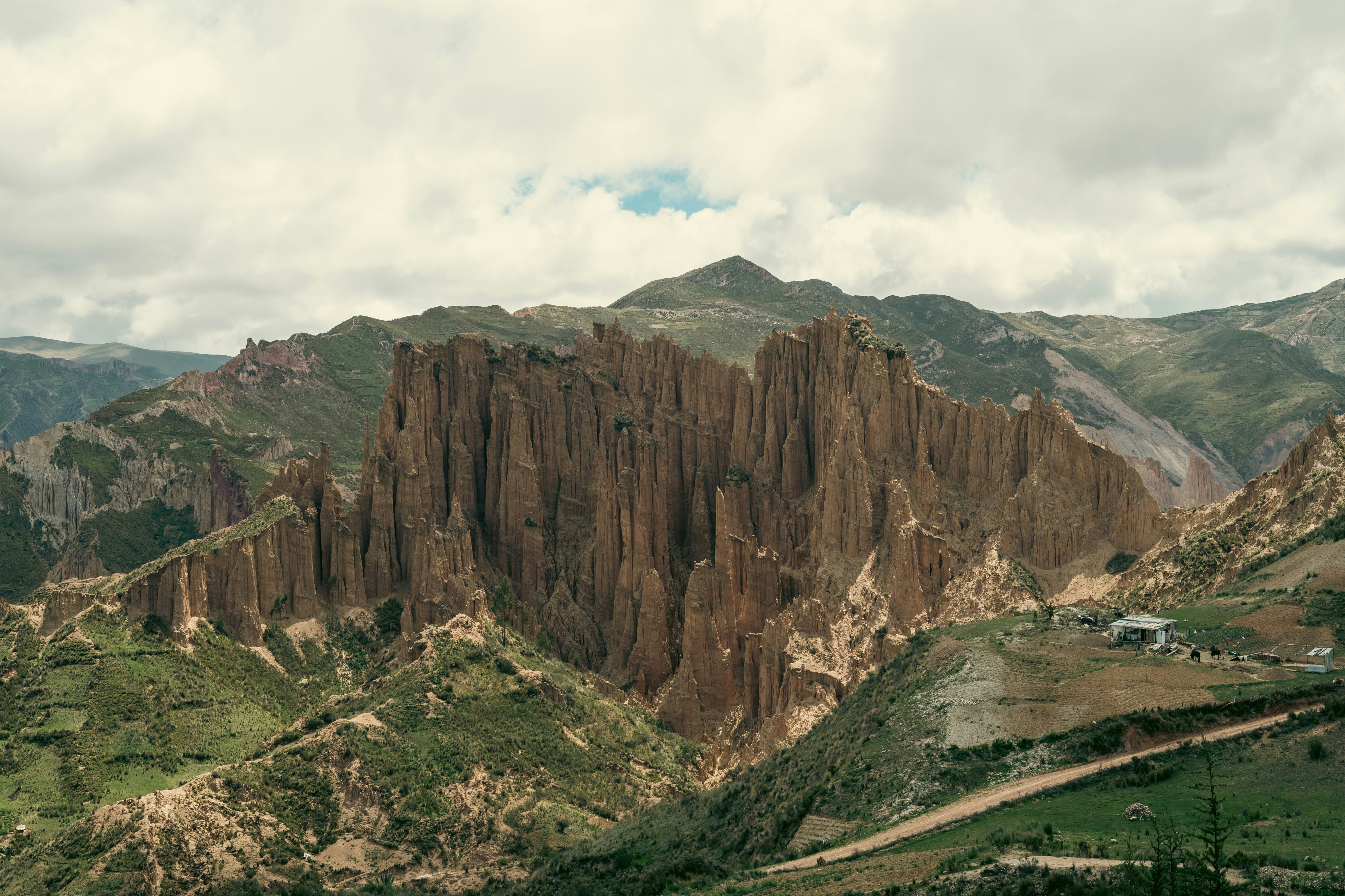 a view of a mountain range from a distance, Back side of the valley of the lost souls (Valle de las animas) seen from the devils tooth (Muela del diablo(