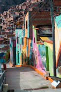 a city street with a lot of graffiti on the buildings