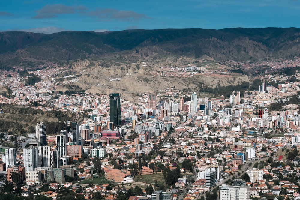 a view of a city with mountains in the background