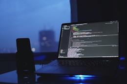 a laptop computer sitting on top of a desk