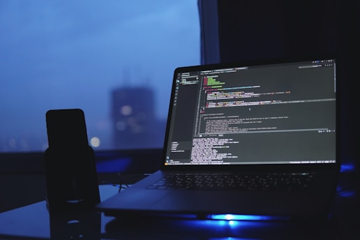 a laptop computer sitting on top of a desk