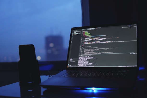 a laptop computer sitting on top of a desk