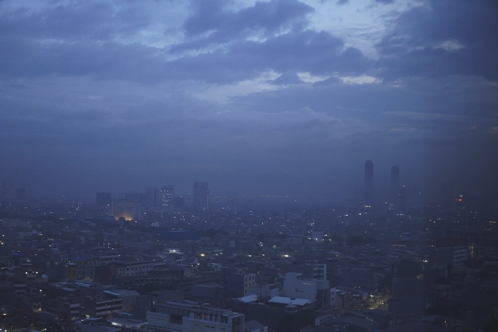 a view of a city at night from the top of a building