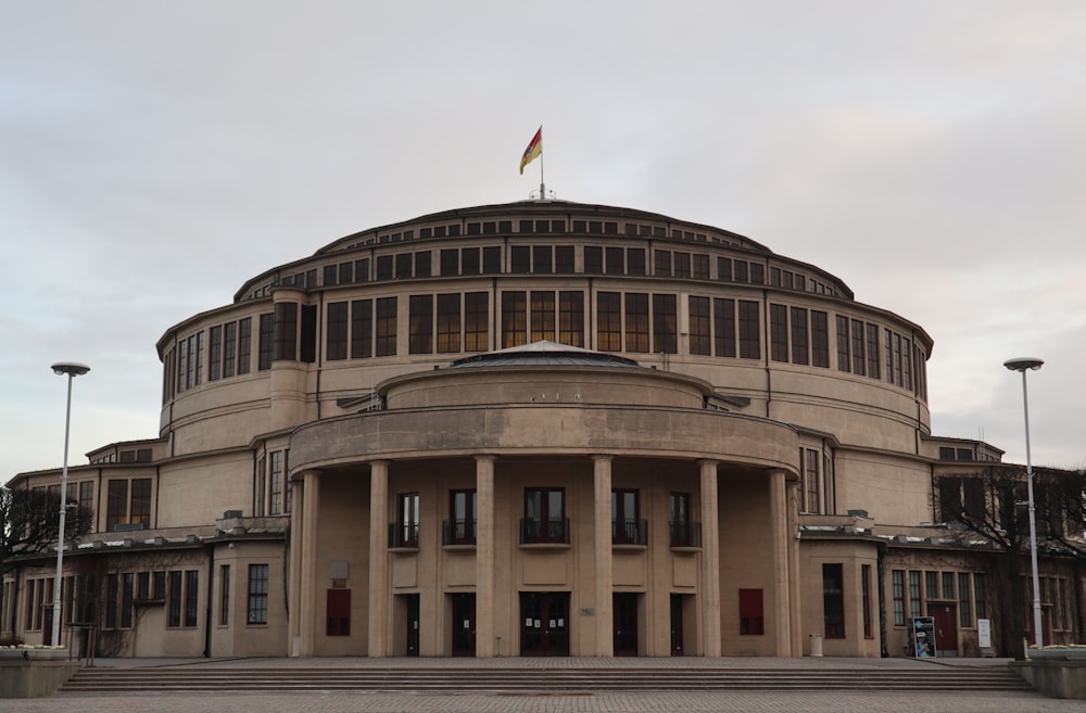 a large building with a flag on top of it