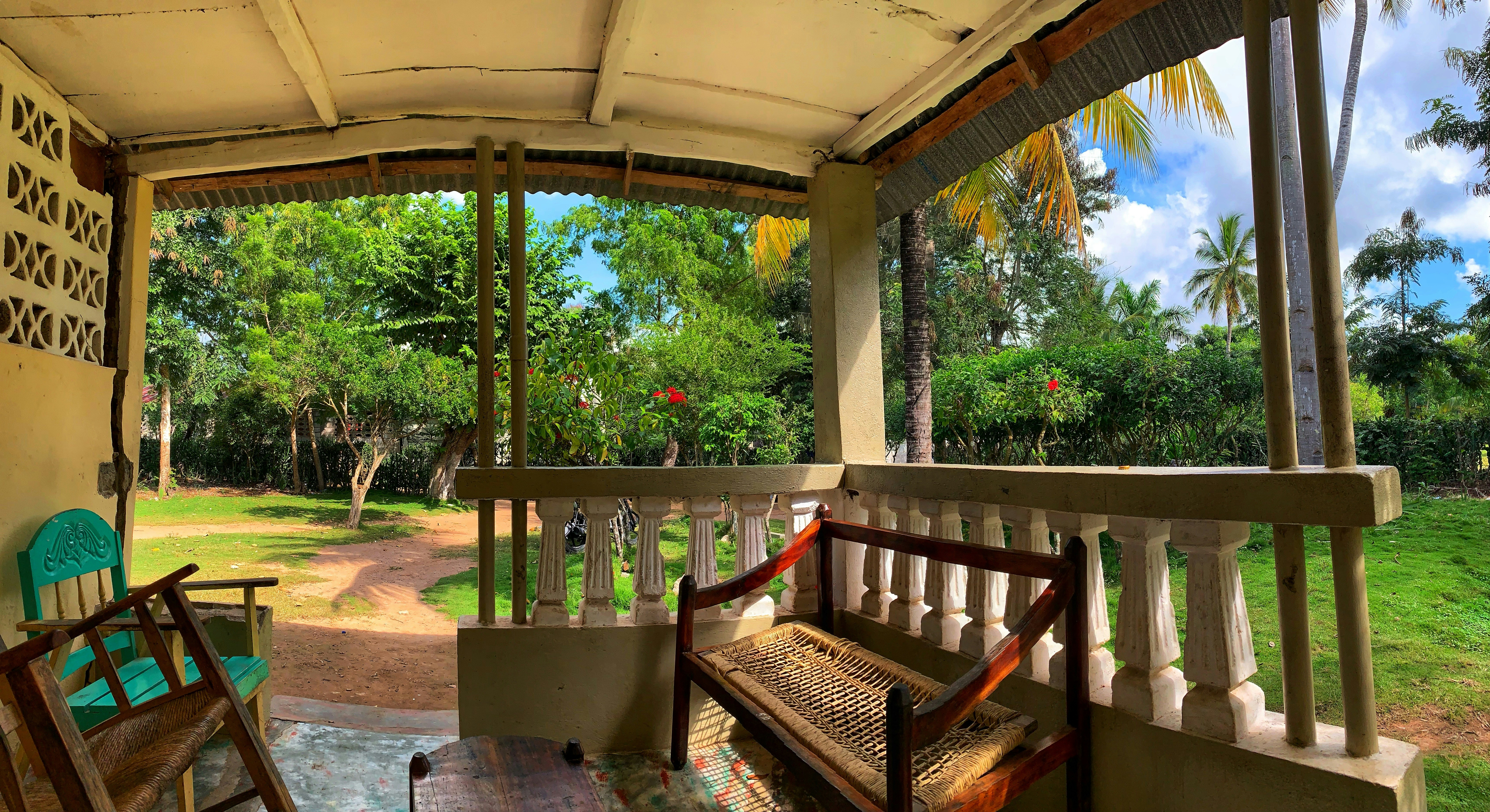a wooden bench sitting on top of a porch