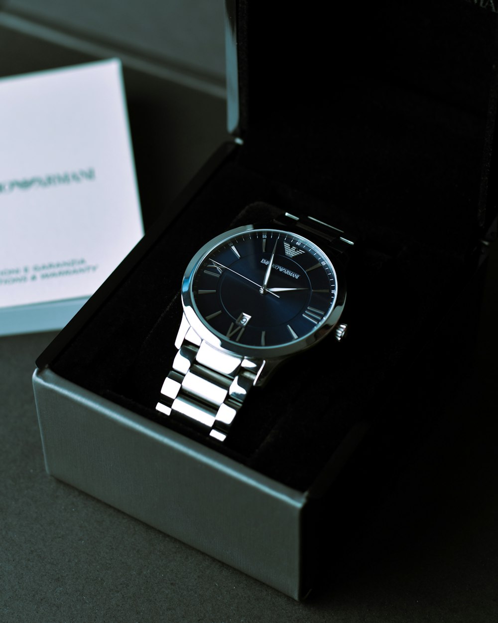 a watch sitting in a box on a table