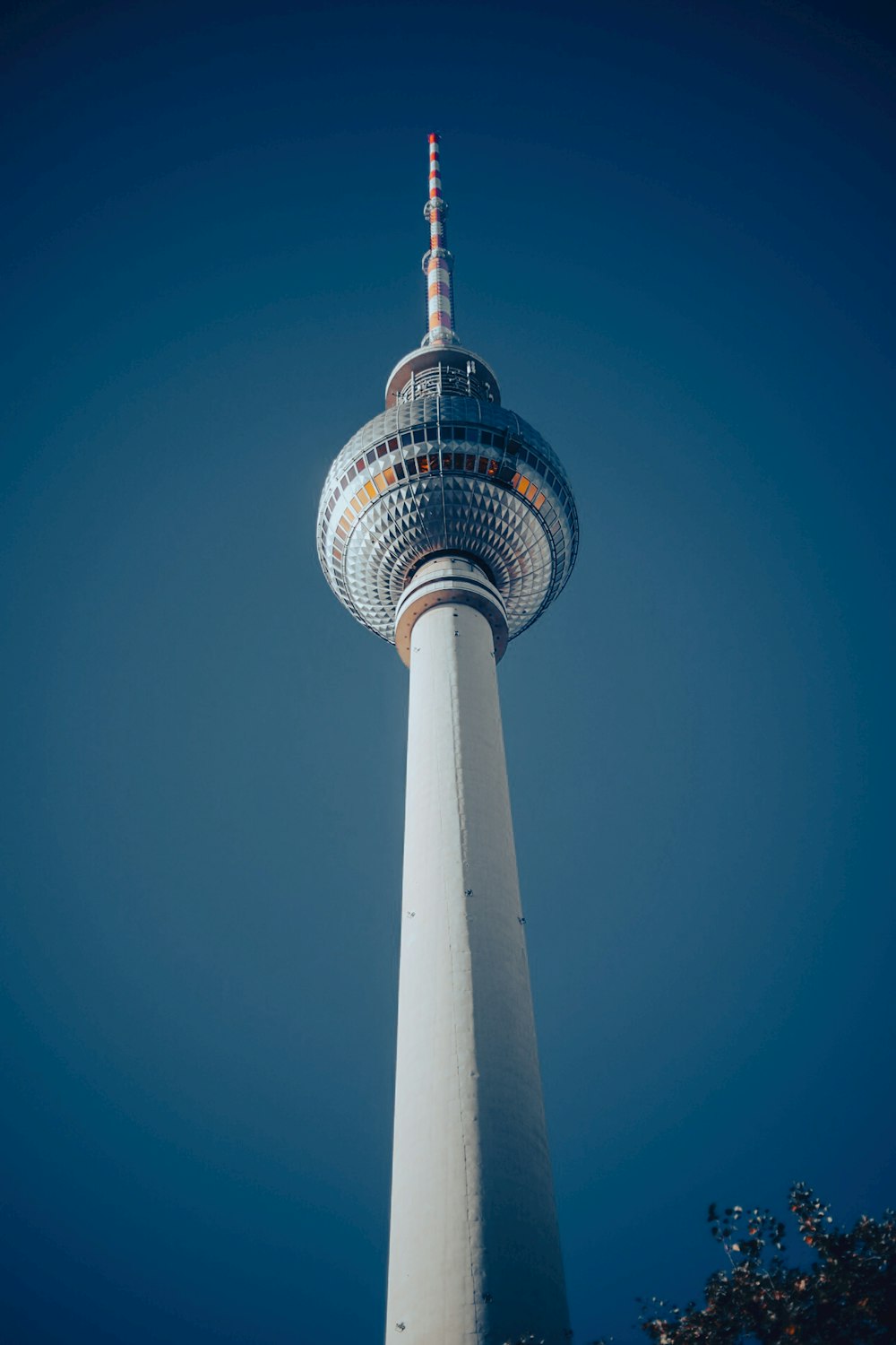 a tall white tower with a sky background