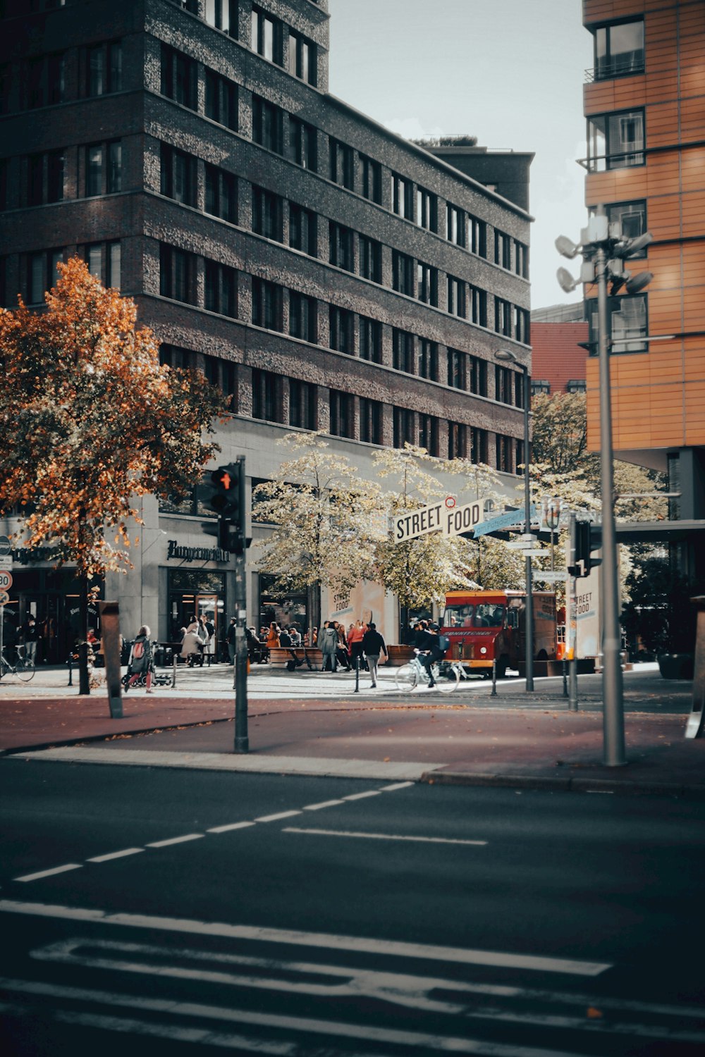 a street corner with a traffic light and a building