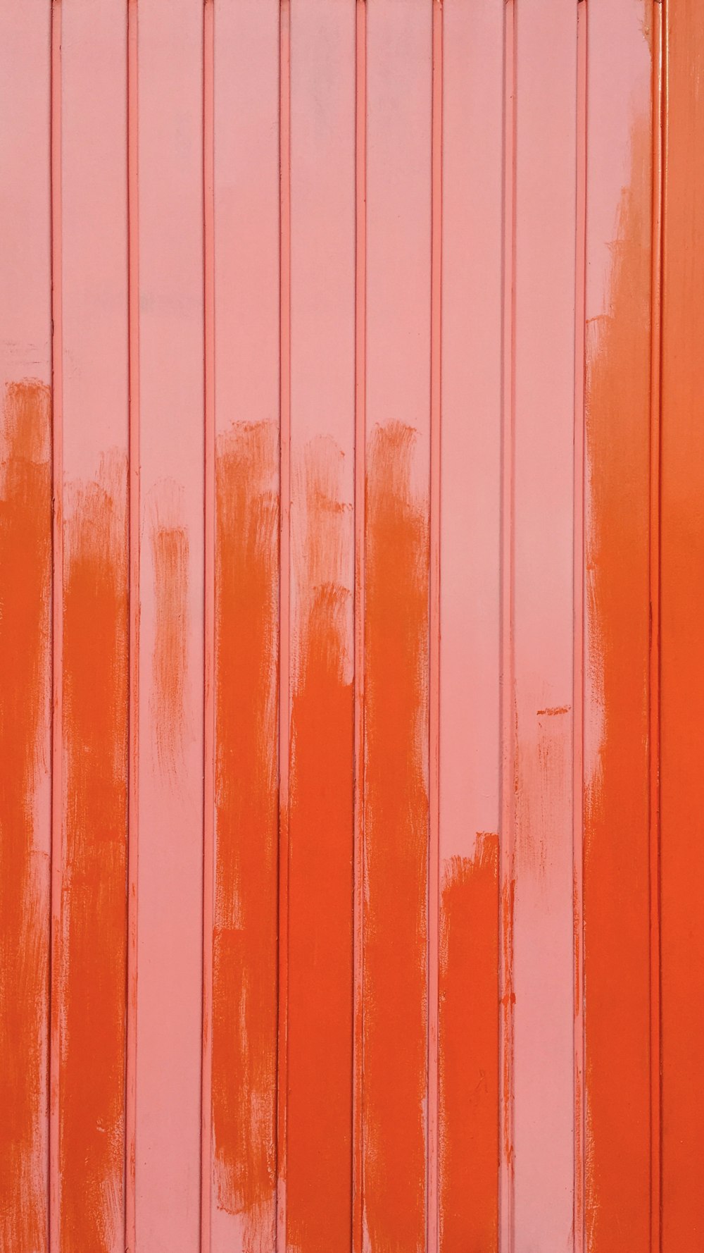 a close up of a wall with orange paint