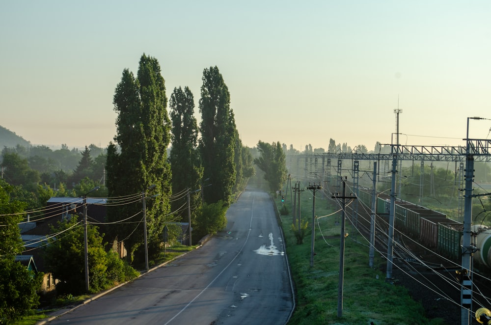 an empty street with power lines above it
