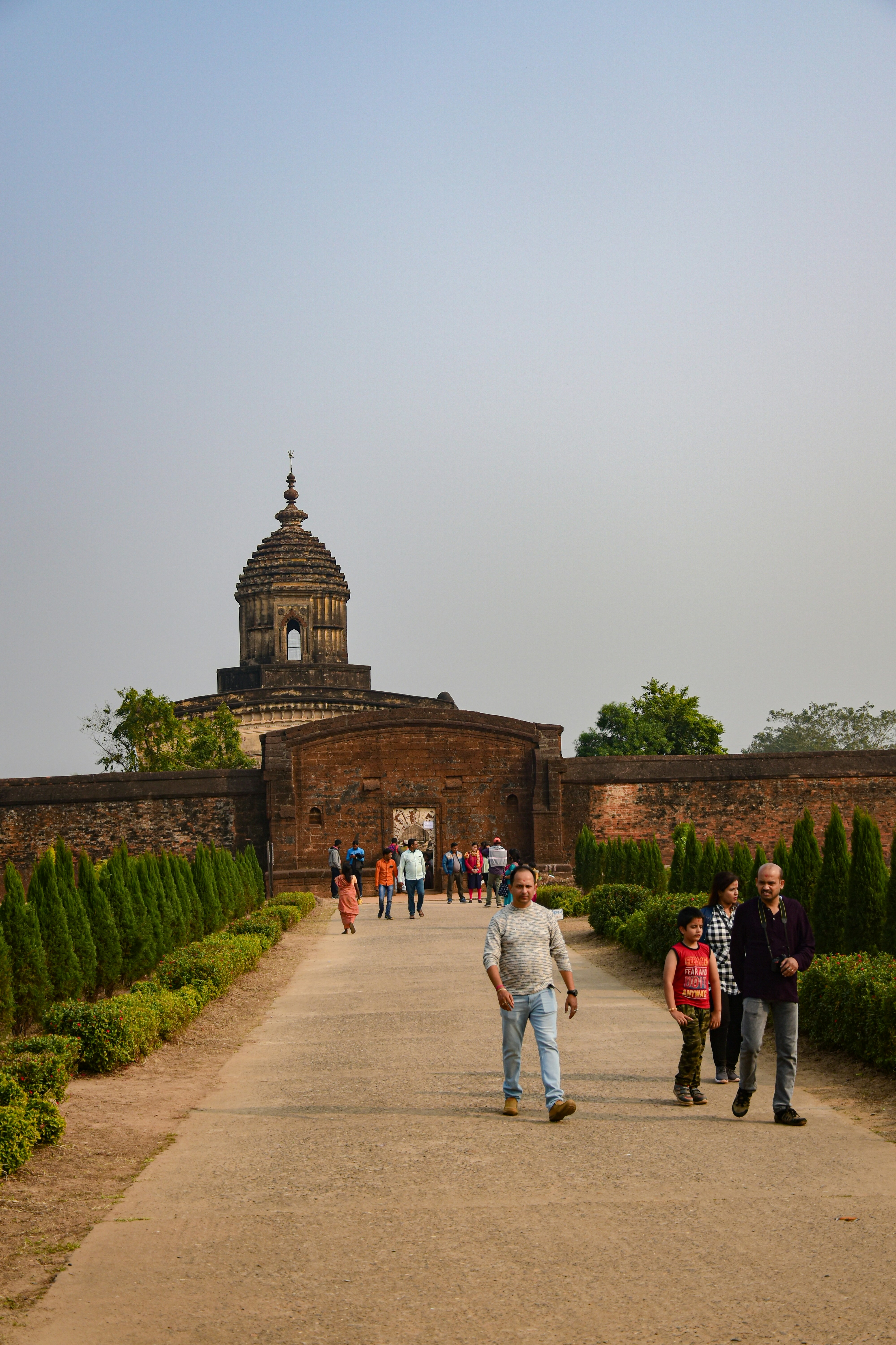 a group of people walking down a pathway