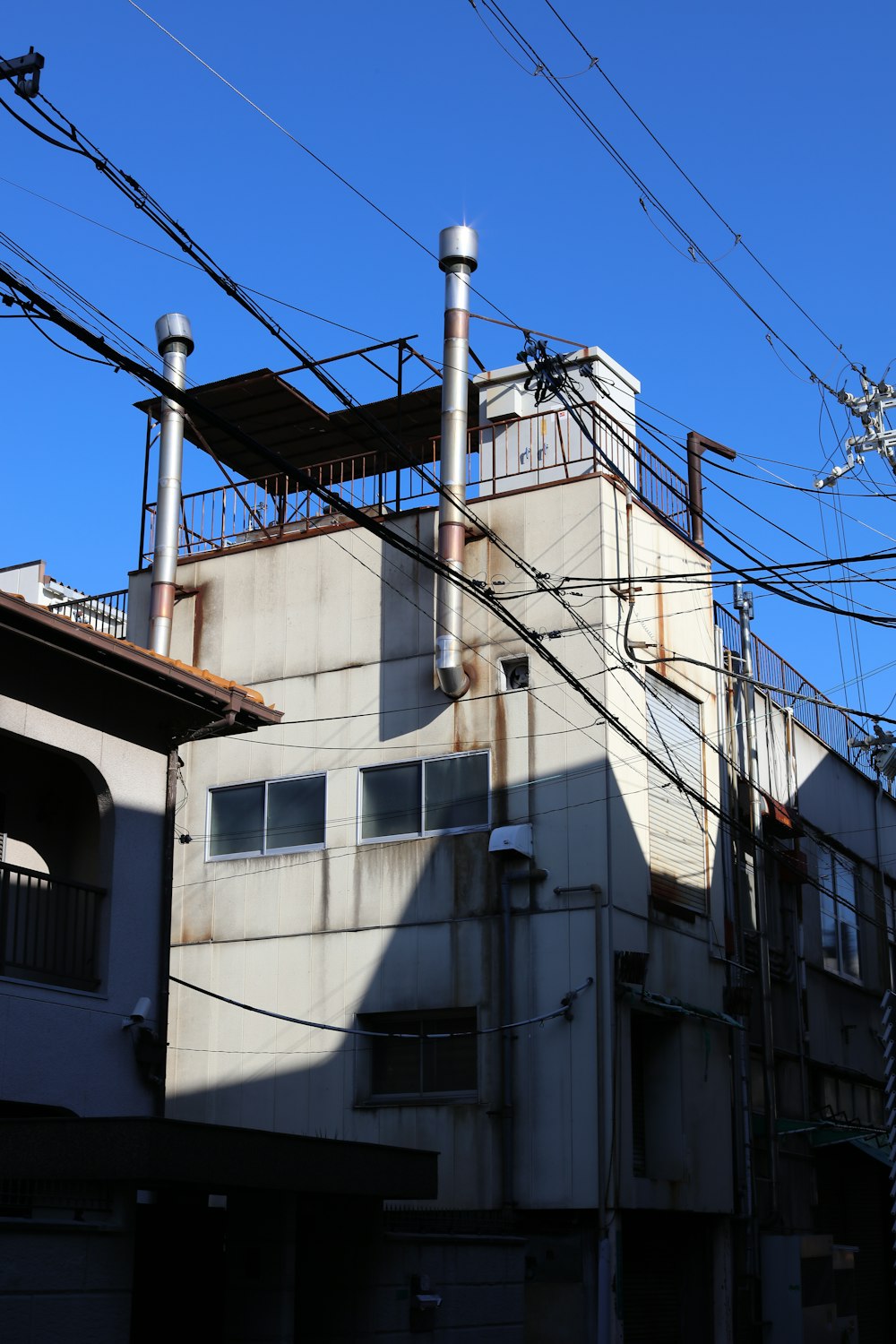 a building with a lot of power lines above it