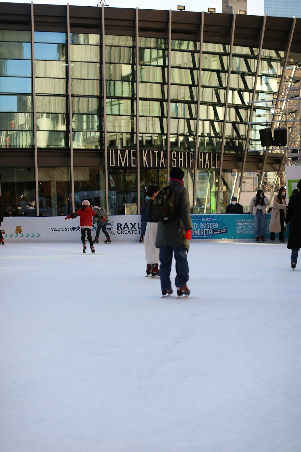 a man riding a skateboard down a snow covered slope