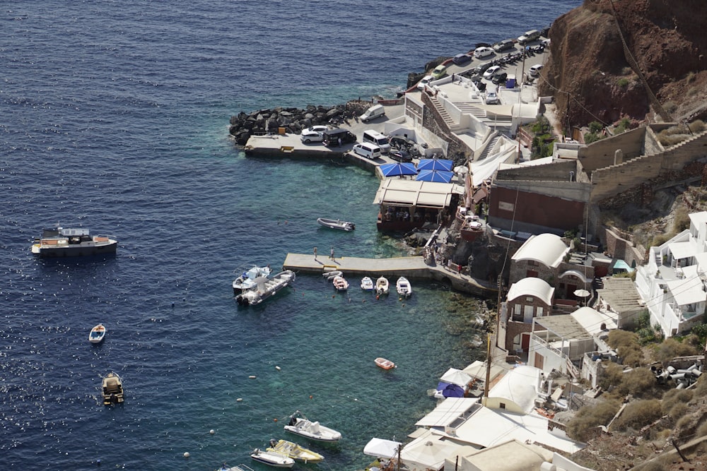 a group of boats floating on top of a body of water