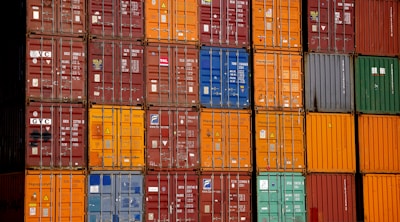 a large stack of containers stacked on top of each other