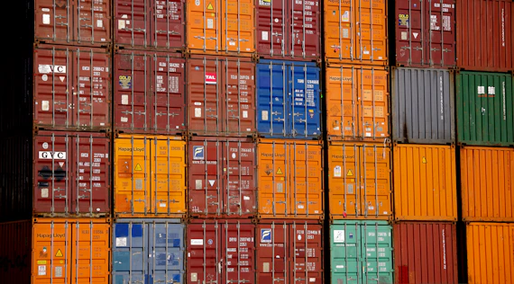 a large stack of containers stacked on top of each other