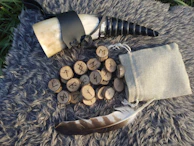 A Viking horn mug set against a backdrop of a roaring fire in a cozy cabin.