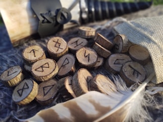 Close-up of hands drawing runes from a velvet pouch during a session.