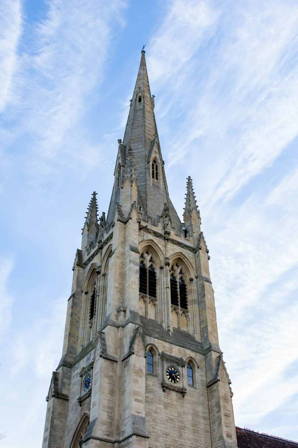 a very tall tower with a clock on it's side