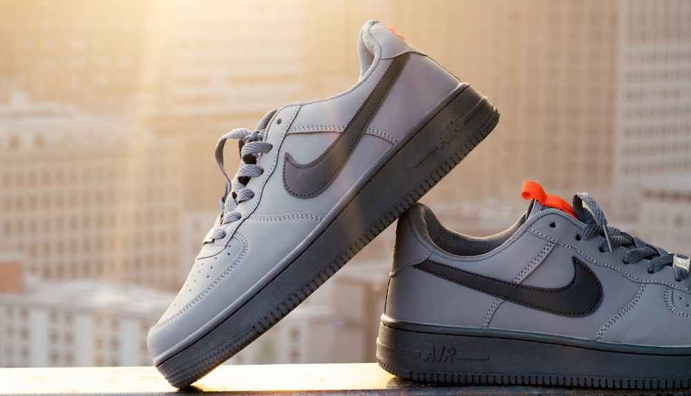 a pair of grey nike air force sneakers