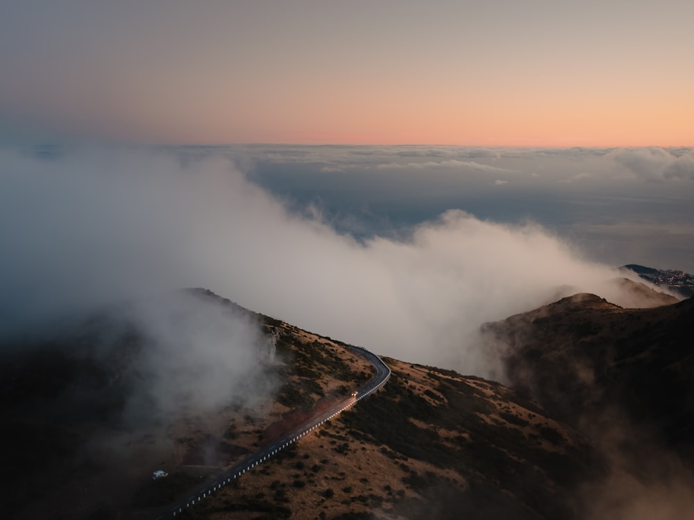 a winding road in the middle of a mountain