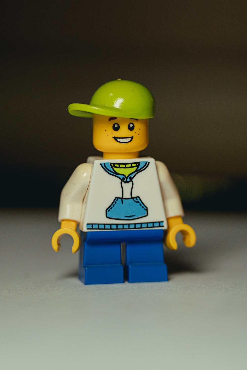 a lego man wearing a green hat and a white shirt