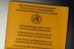 a close up of a yellow sign on a wall