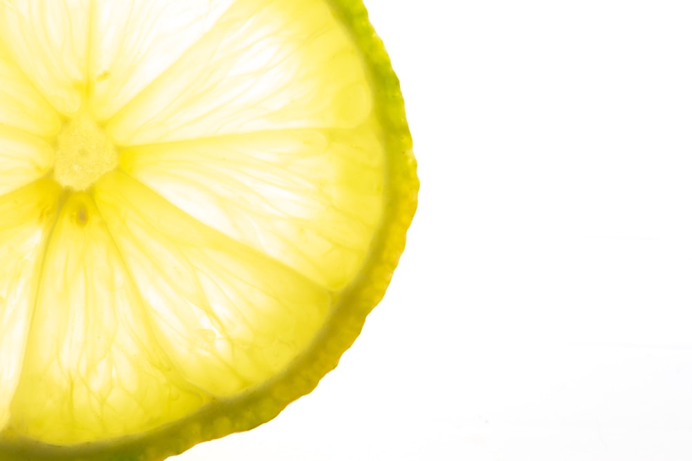 a slice of lime with a white background