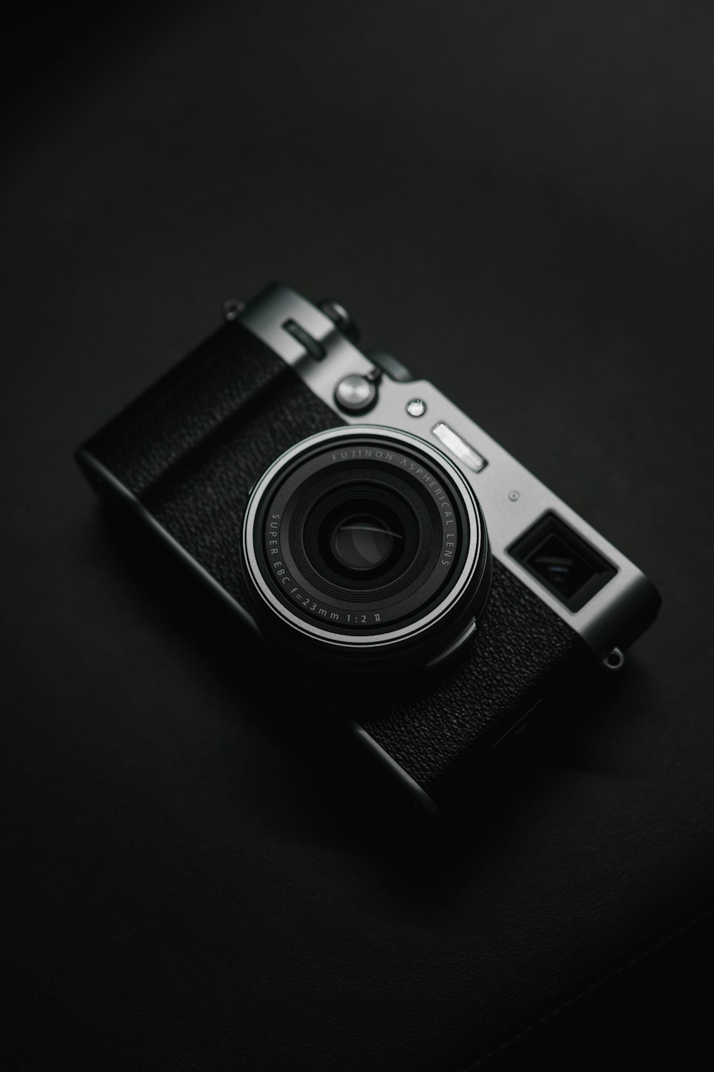 a camera sitting on top of a black table