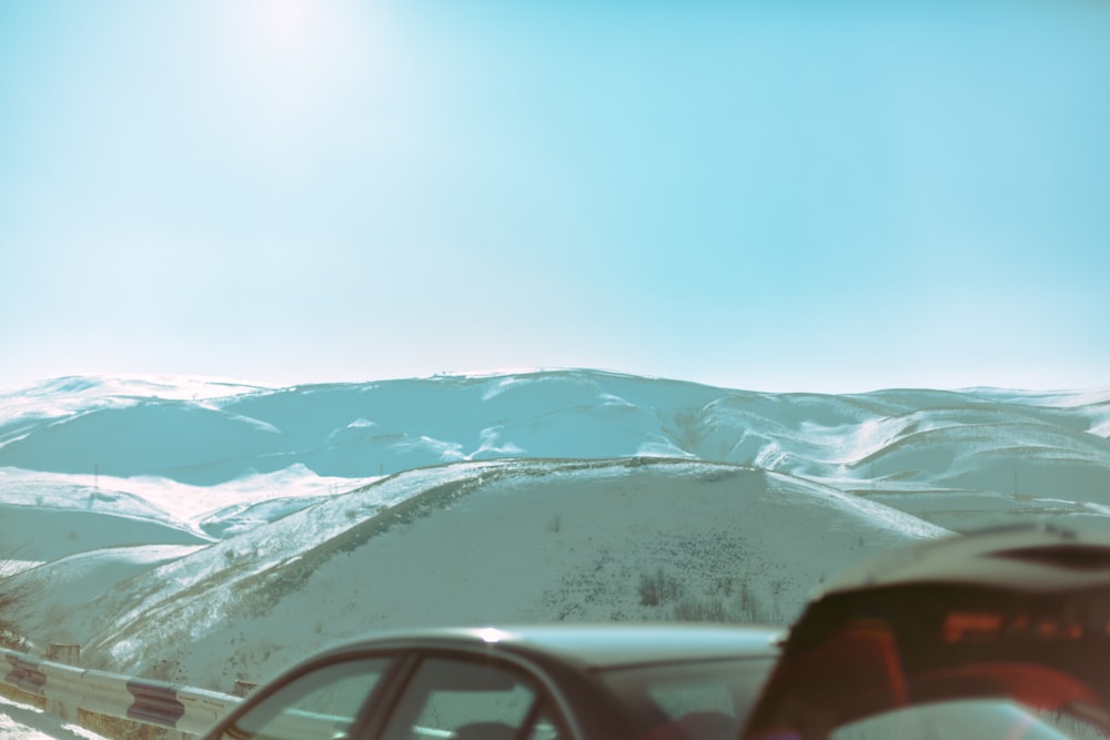 a car driving down a snow covered road