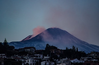 a mountain with a cloud in the sky