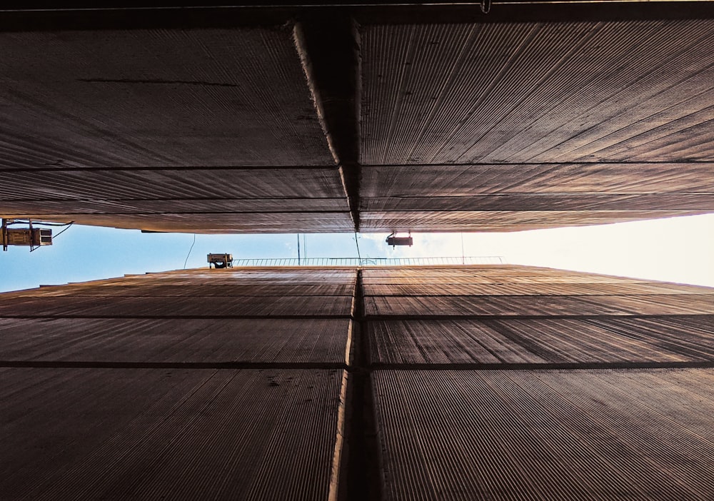 looking up at the underside of a building