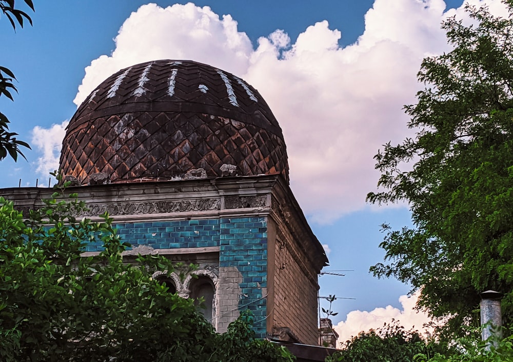 a dome on top of a building surrounded by trees