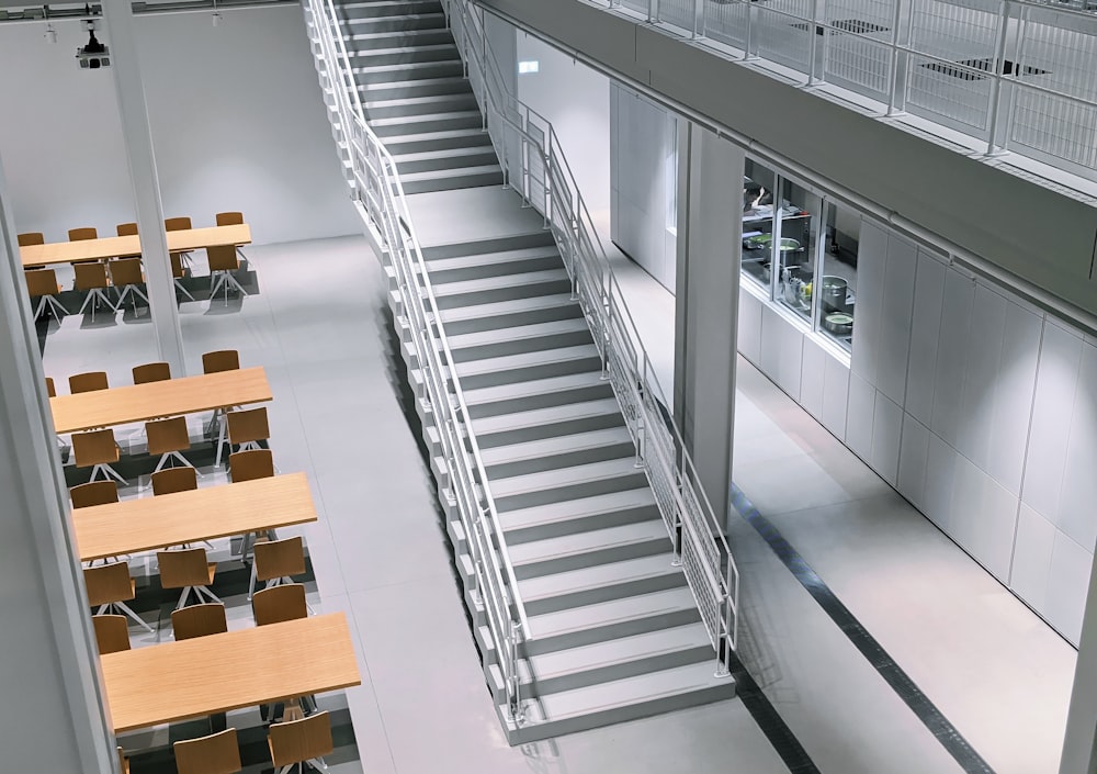 a large building with a bunch of tables and chairs