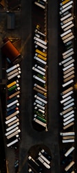 an aerial view of a parking lot with cars parked in it