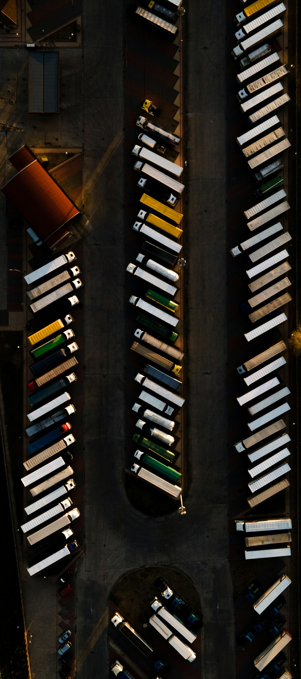 an aerial view of a parking lot with cars parked in it