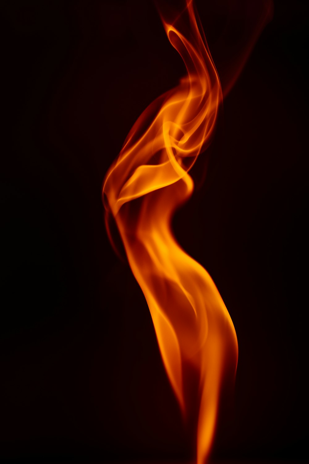 a close up of a fire on a black background