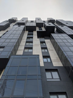 Completed multi-story commercial building with sleek black and white facade