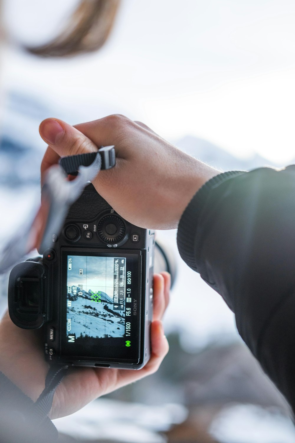 a person holding a camera in their hand