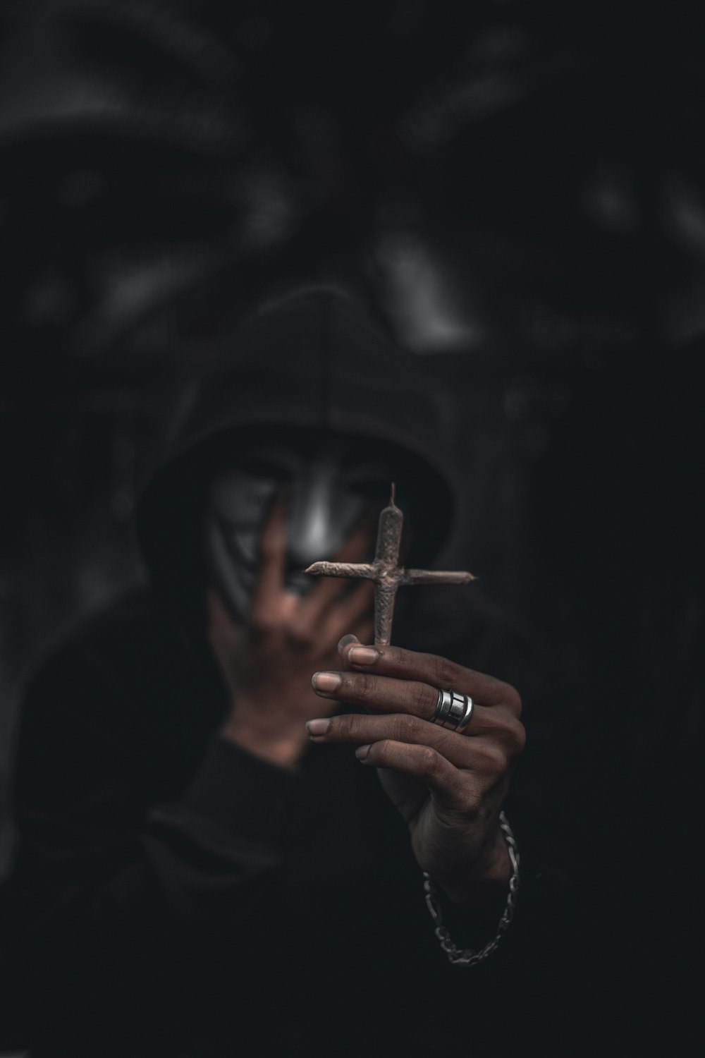 a person holding a cigarette in their hand