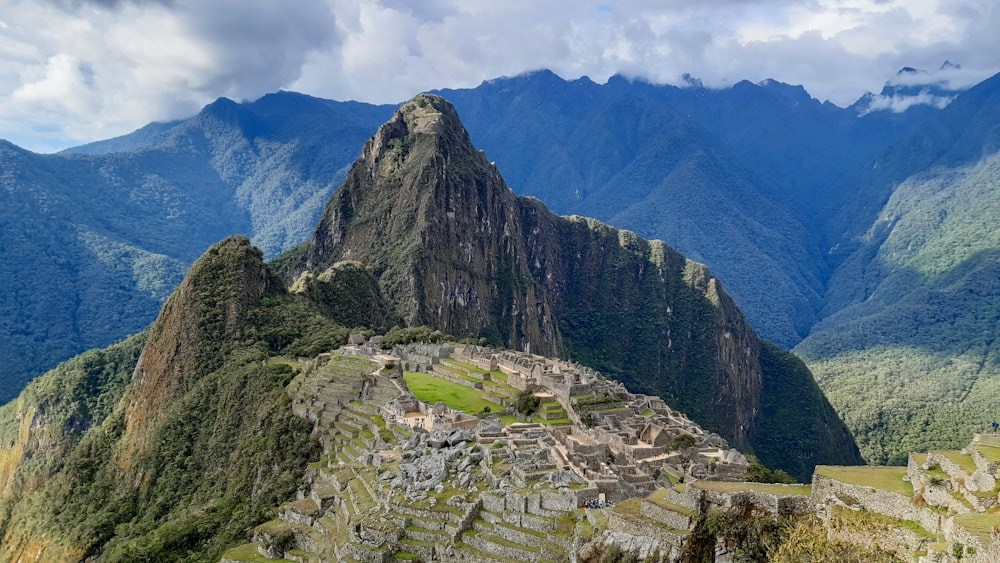 a view of a mountain range with a few ruins