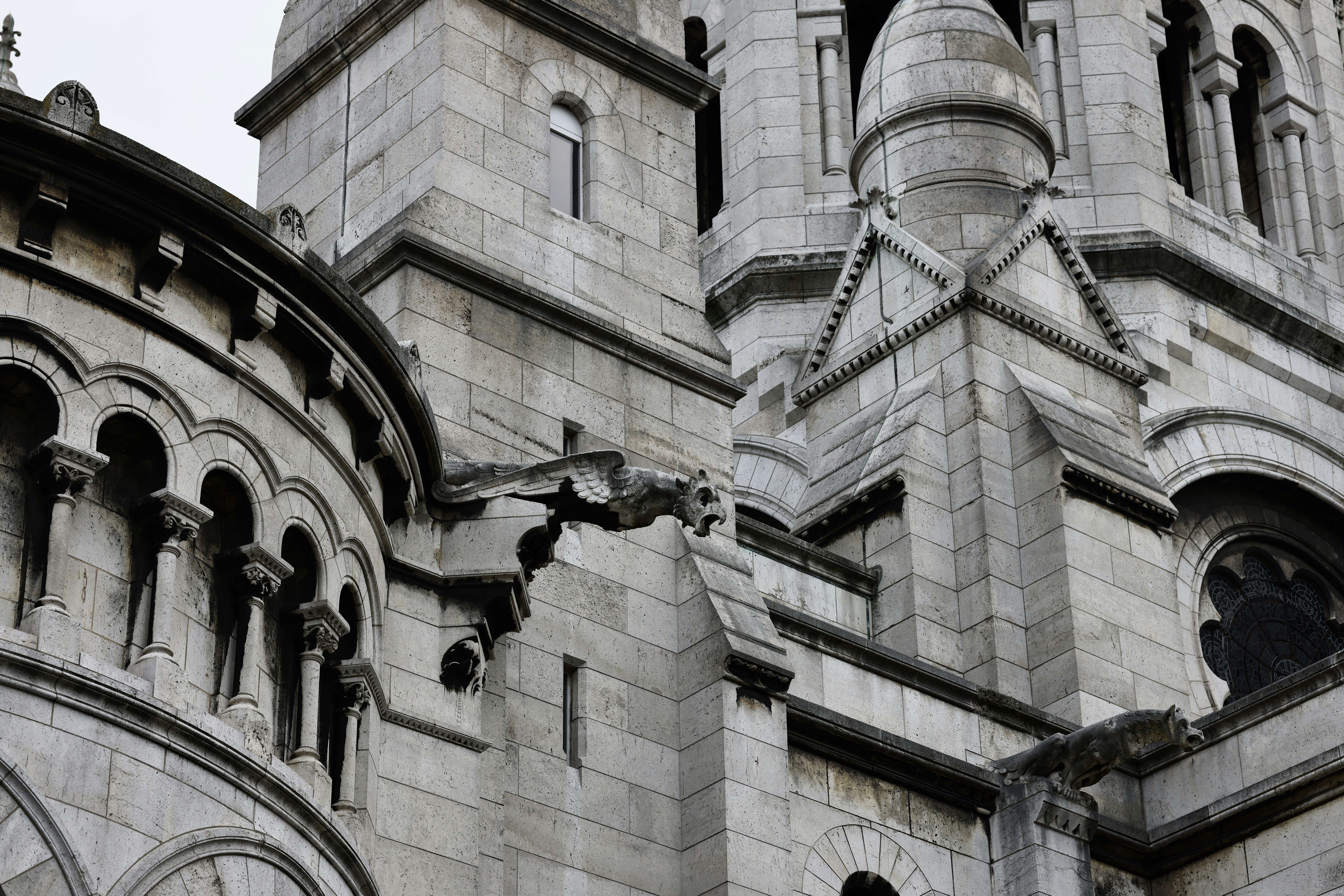 a large stone building with a clock on it's side