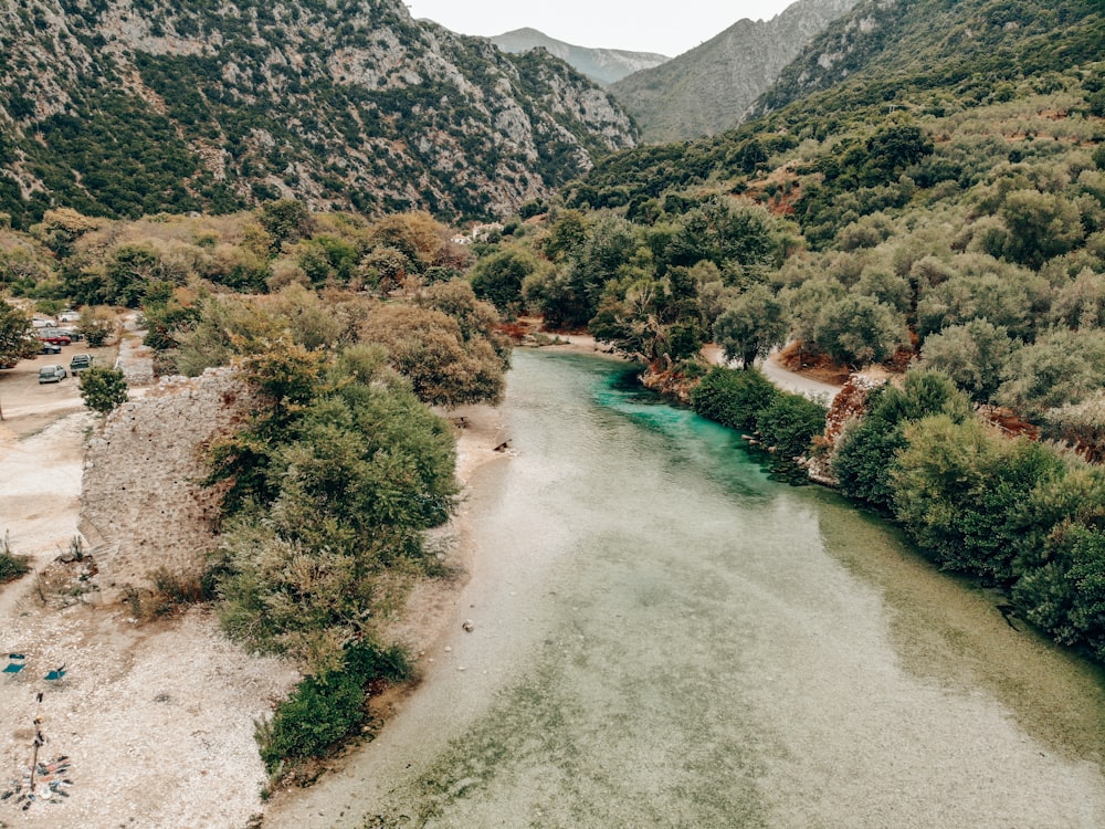 an aerial view of a river surrounded by mountains