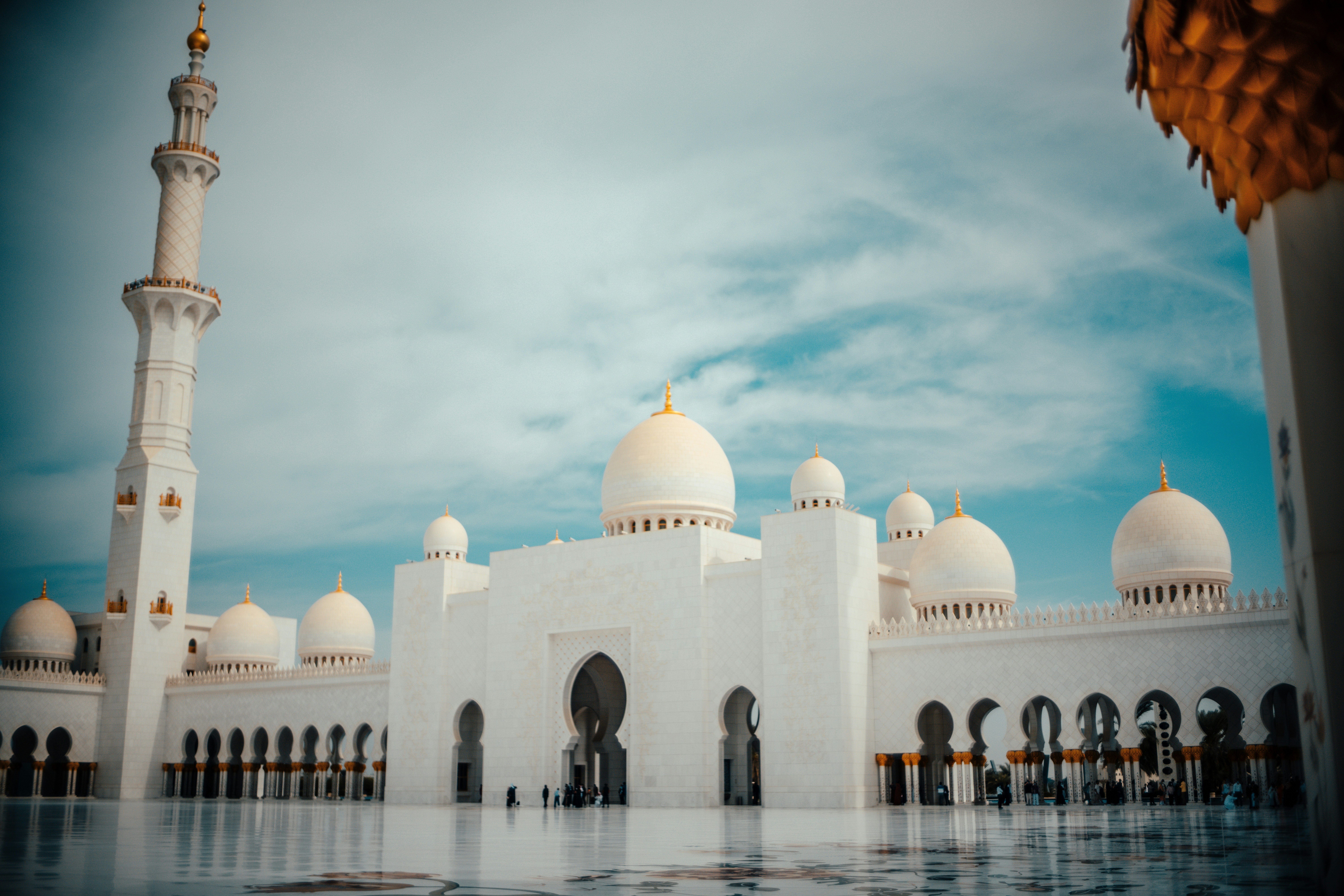 a large white building with a clock on it's side