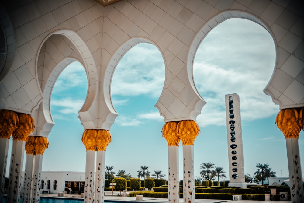 a large white building with arches and arches around it