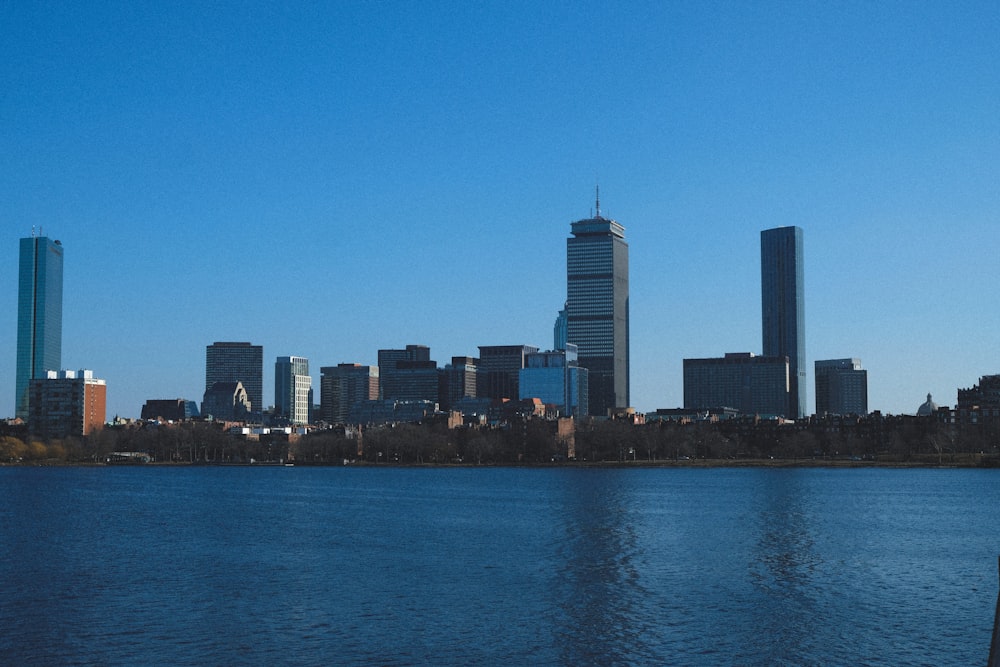 a large body of water with a city in the background