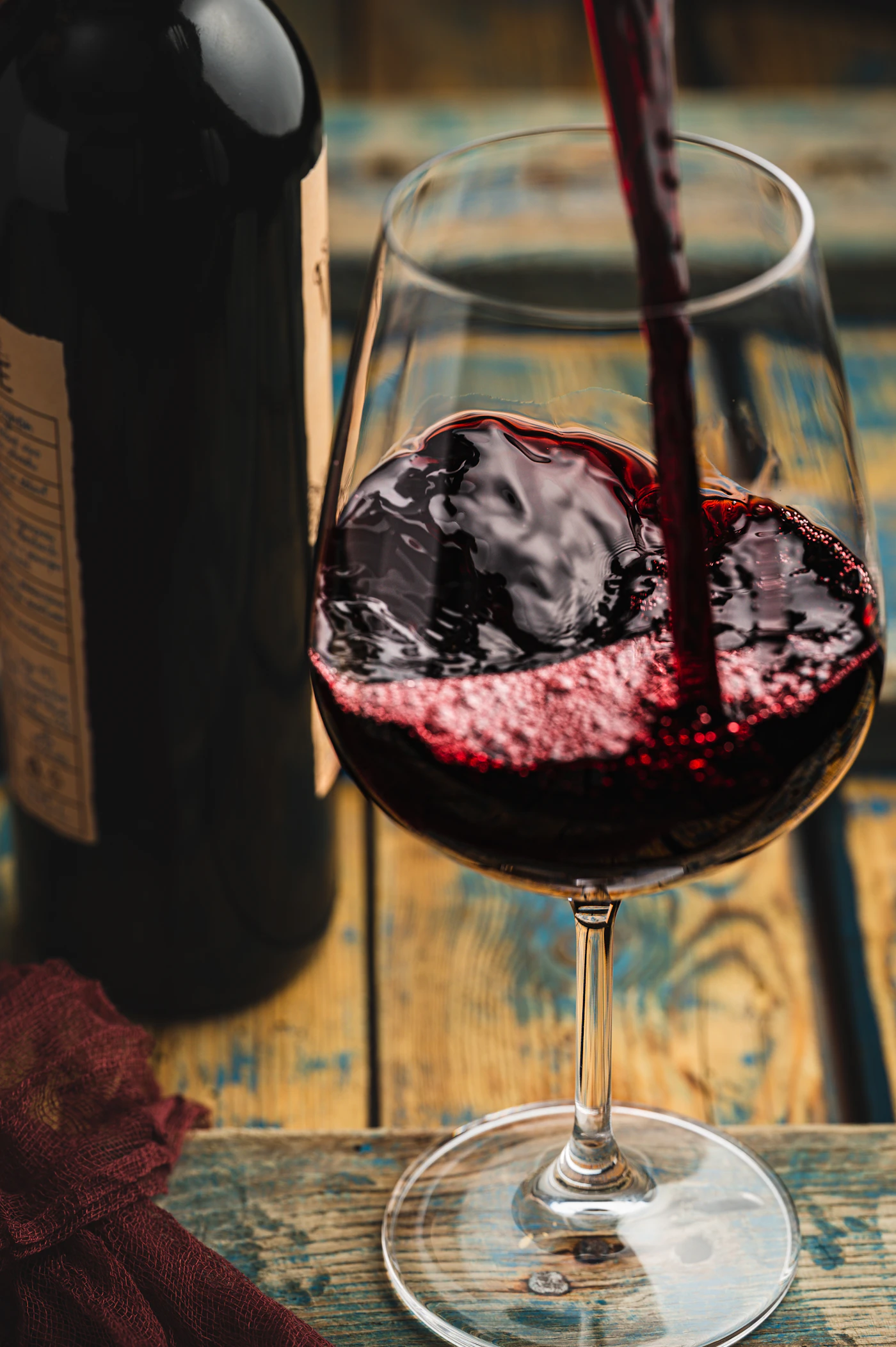 Red wine being poured into a glass